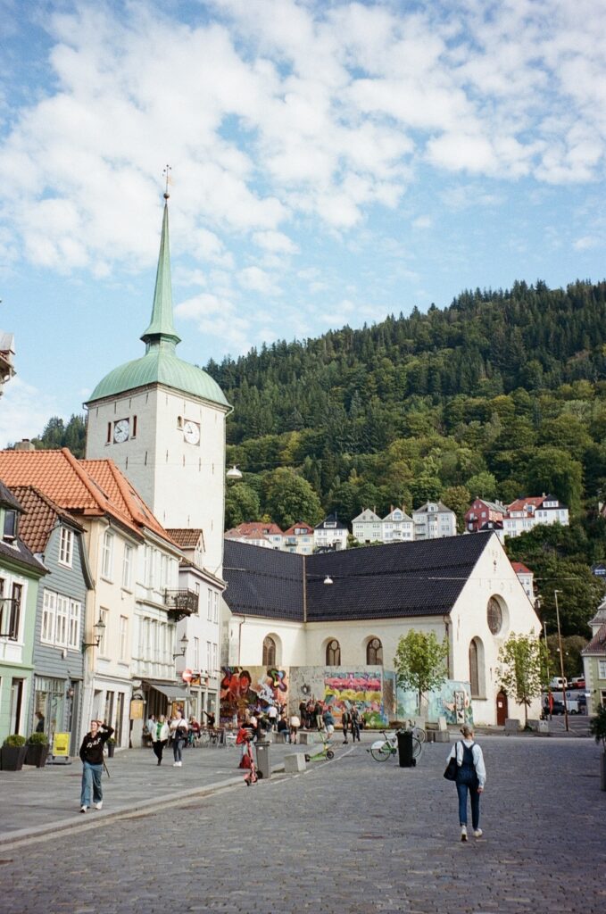 church and street scene by hillside in norway