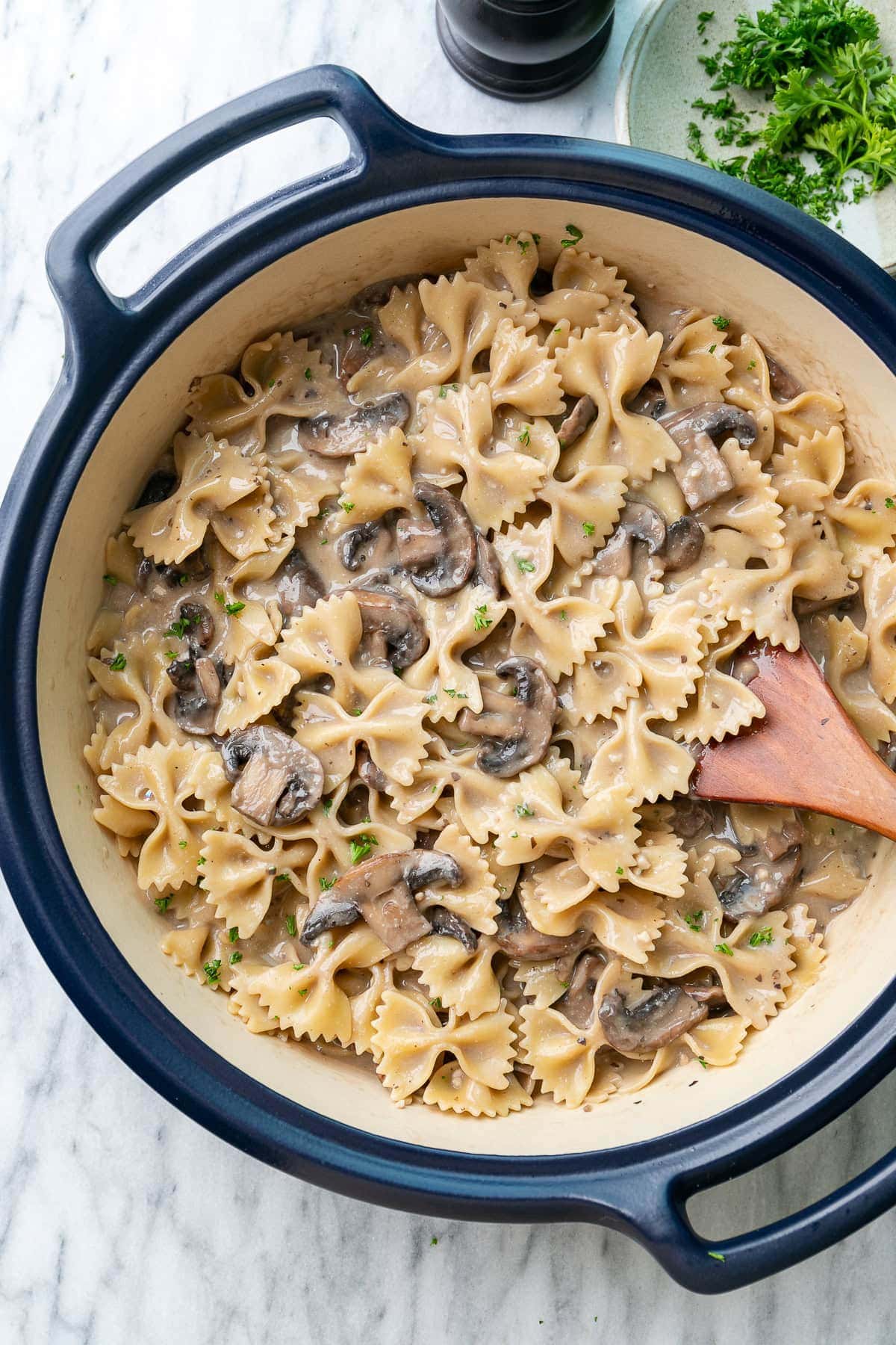 top down view of pot with freshly made creamy mushroom pasta.