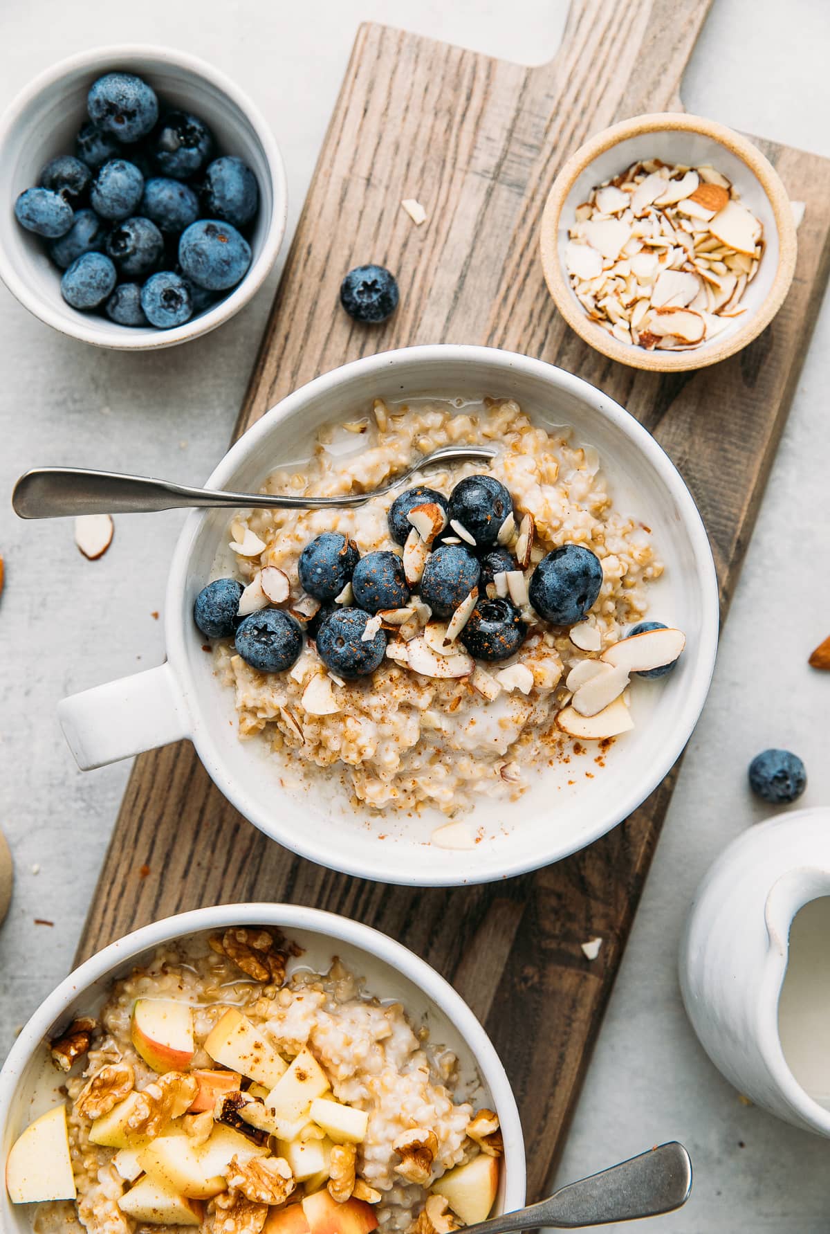 top down view of 2 healthy bowls of Instant Pot steel cut oats in a bowl with flavor topping.