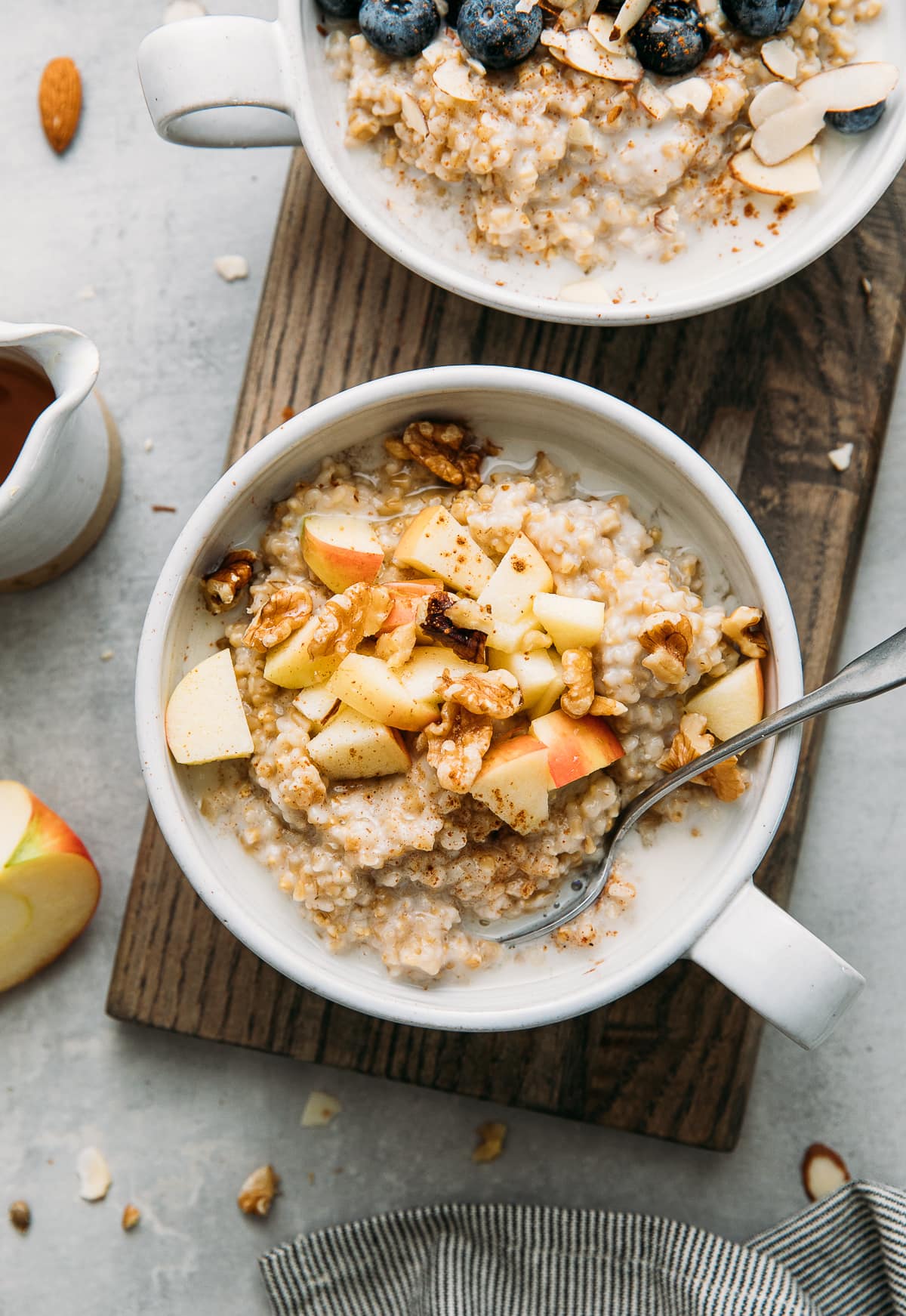 top down view of 2 healthy bowls of Instant Pot steel cut oats in a bowl with flavor topping.