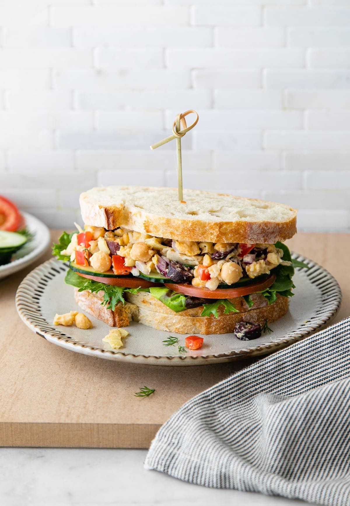 head on view of mashed Mediterranean chickpea salad sandwich.