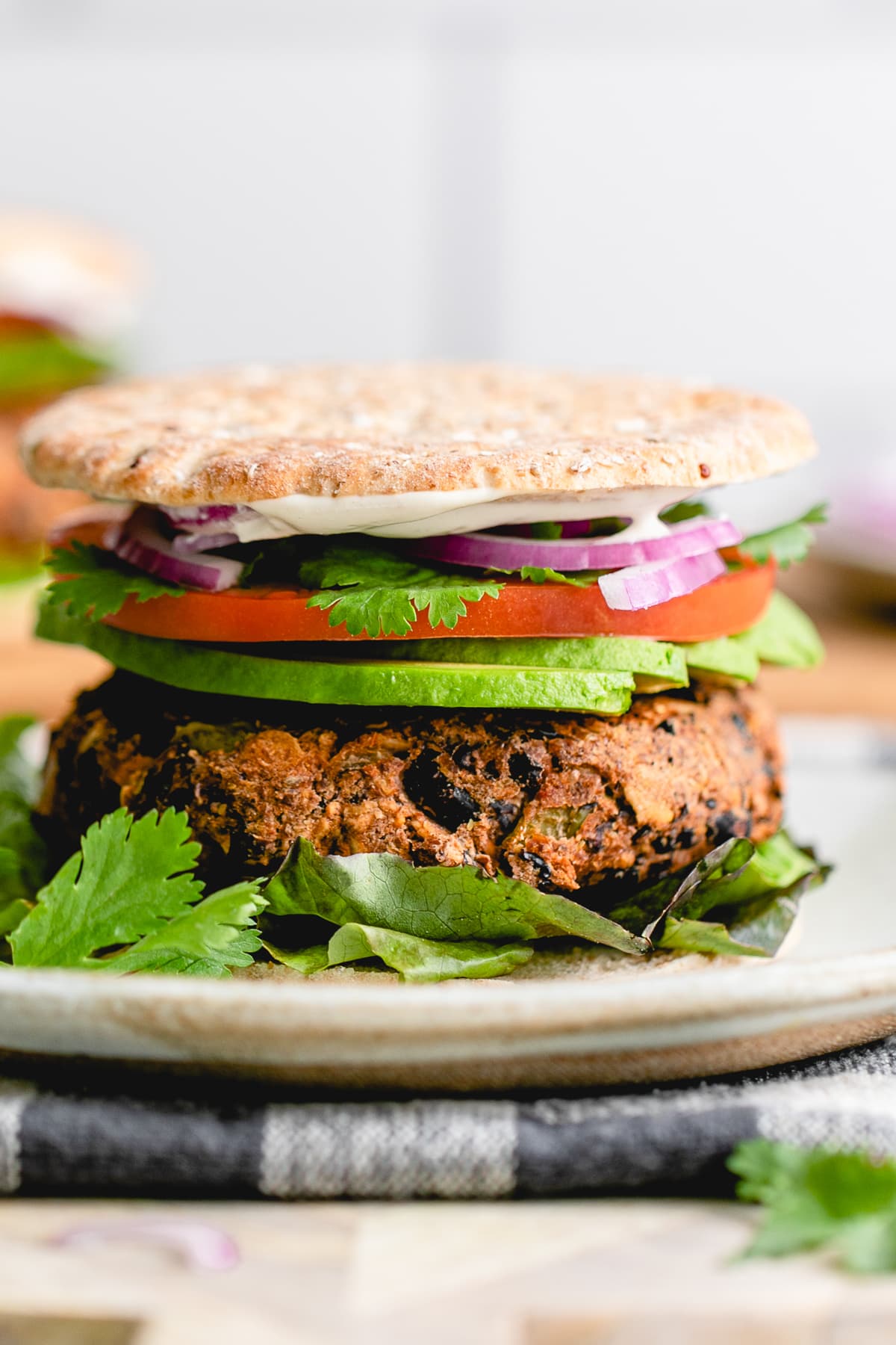 head on view of plated santa fe vegan black burger.