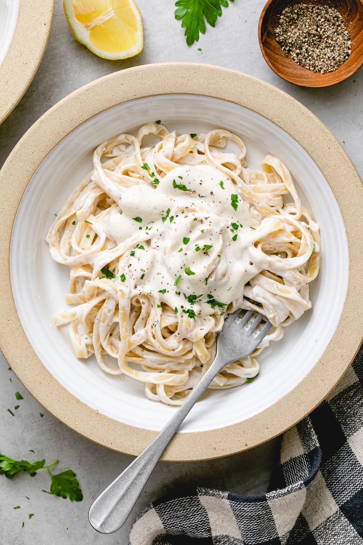 top down view of plated vegan alfredo sauce with pasta.