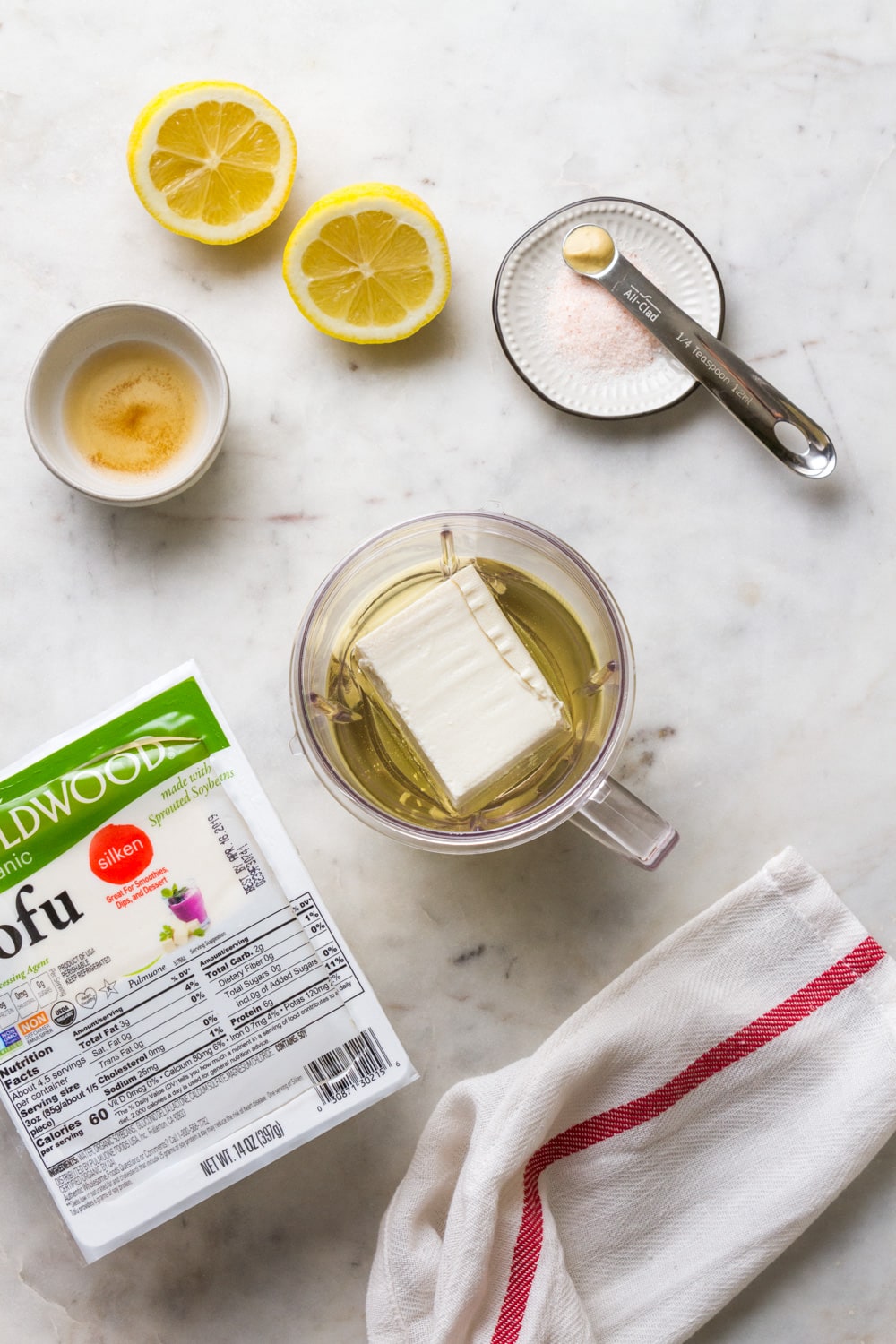 vegan mayonnaise ingredients prepped on a marble countertop