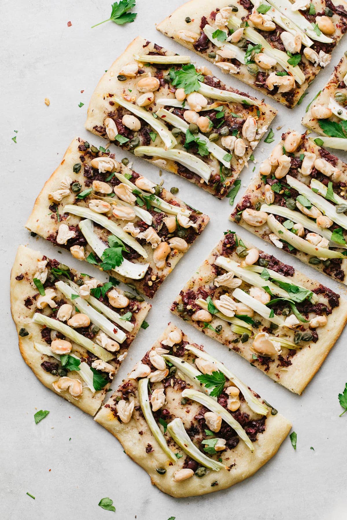 top down view of sliced cannellini fennel flatbread.