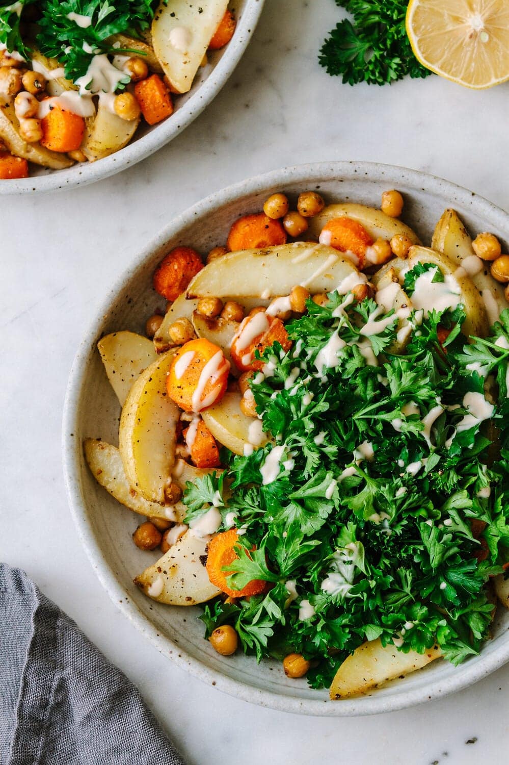 top down view of chickpea, potato and parsley bowl.