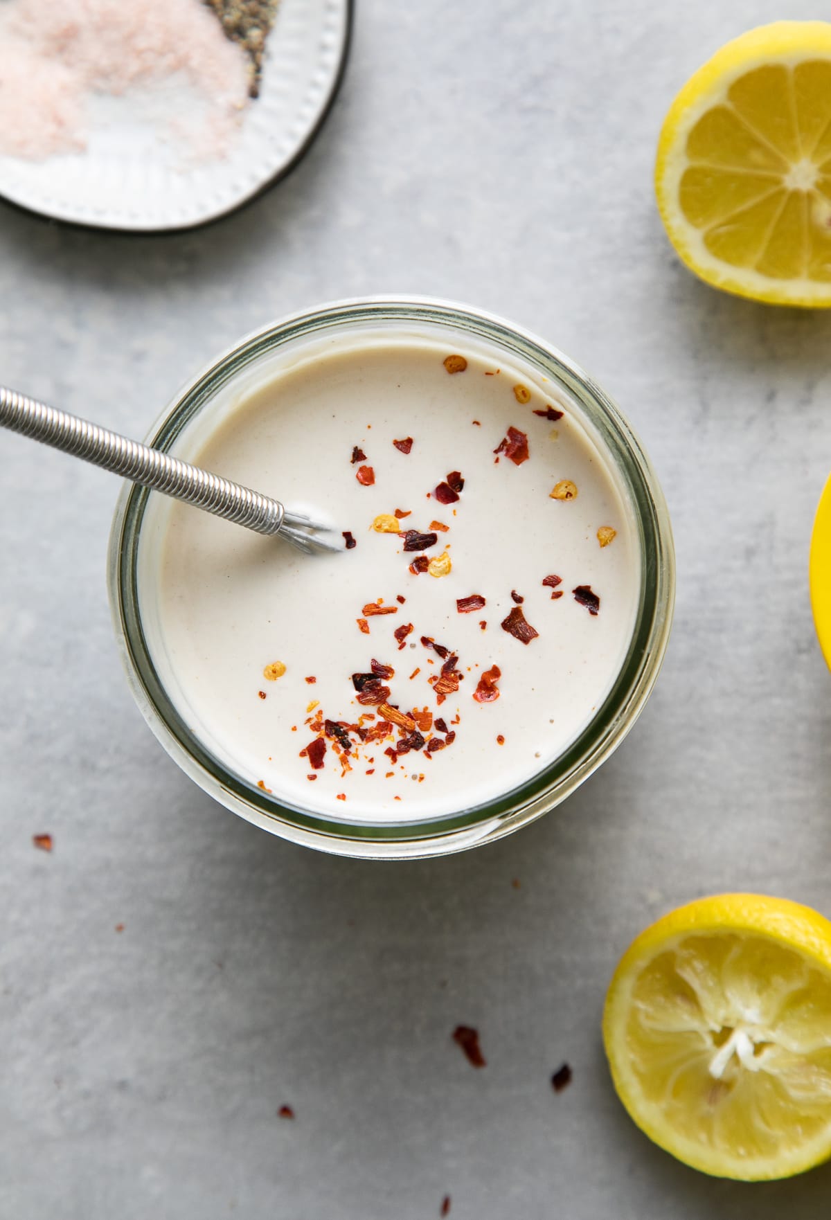 top down view of lemon tahini dressing in a mason jar.