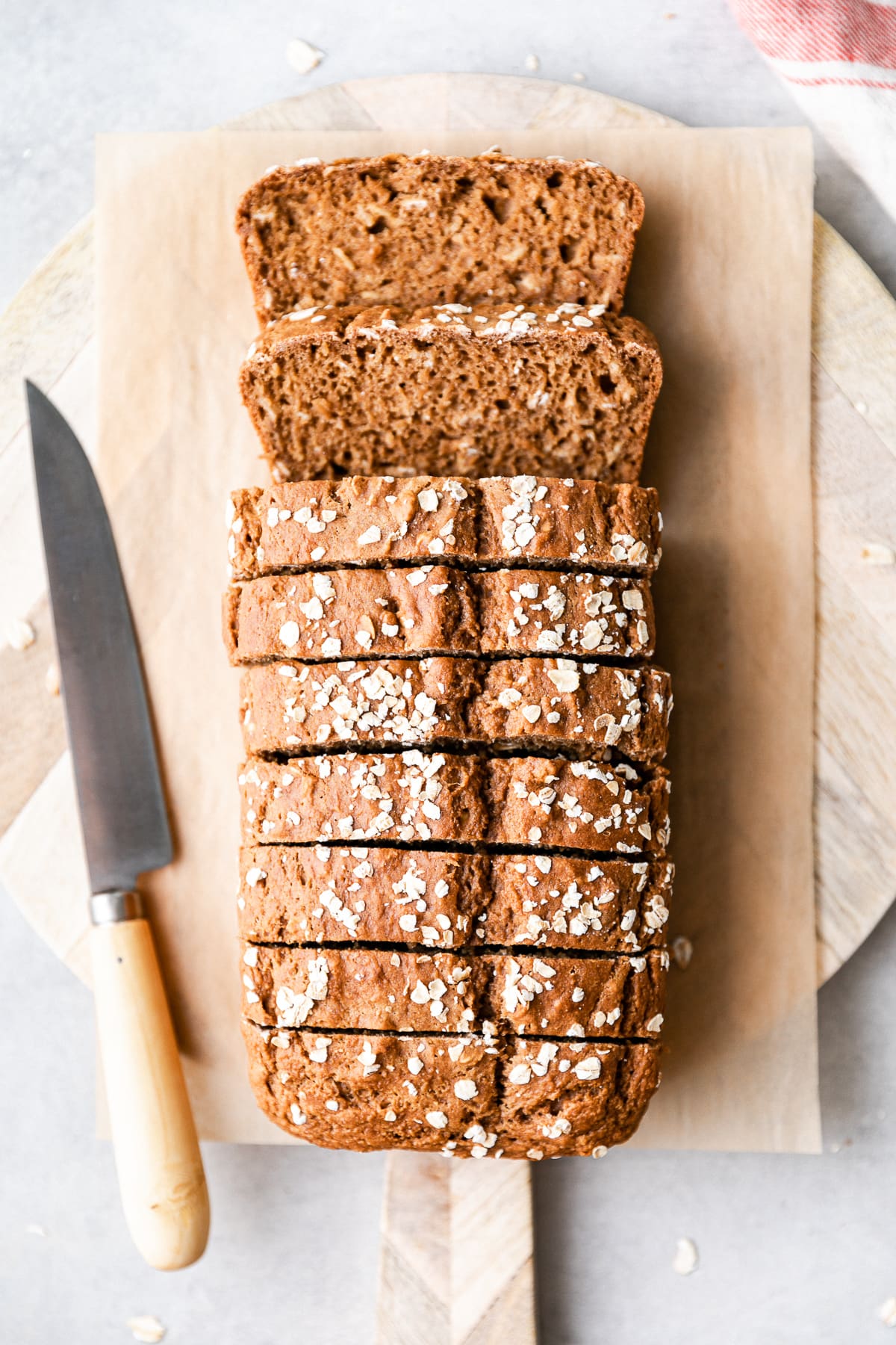 top down view of healthy applesauce bread sliced on a serving board.