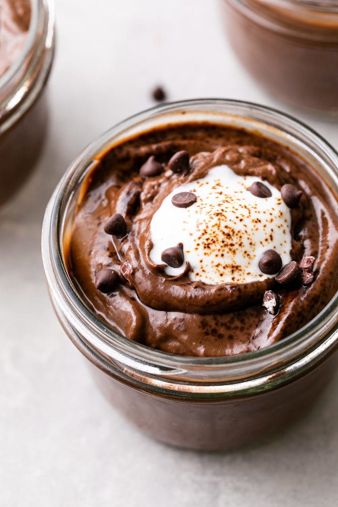 side angle view of healthy raw chocolate avocado pudding with espresso.