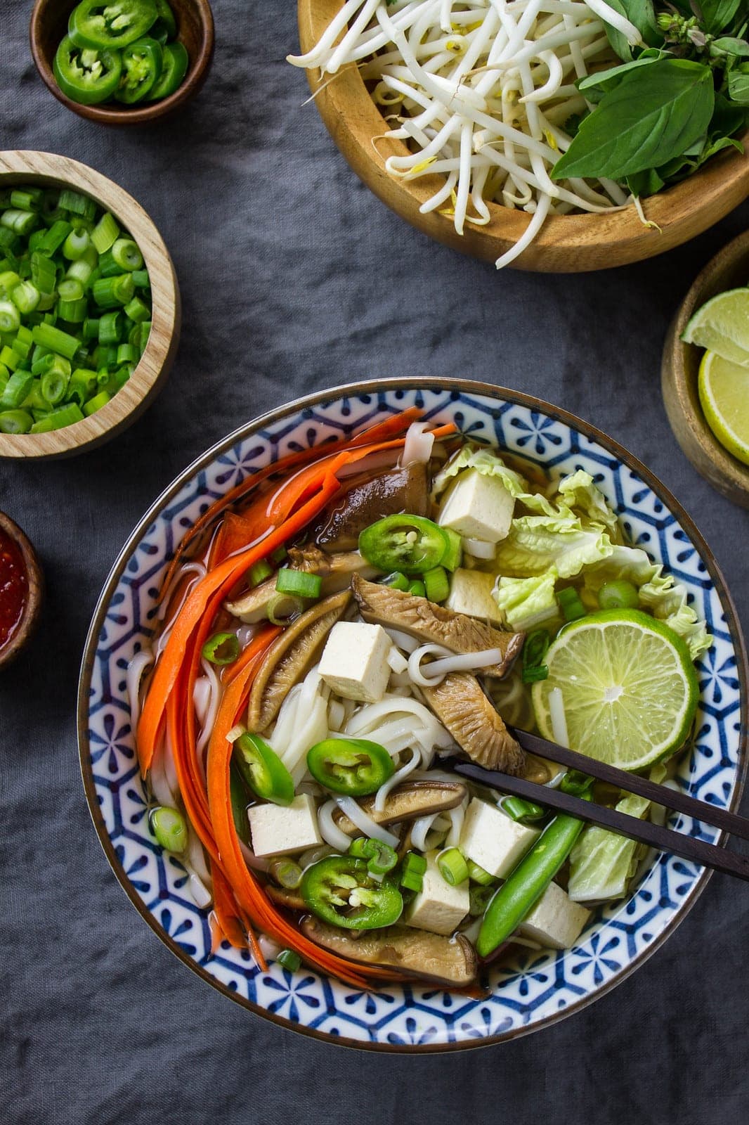 top down view of a bowl of freshly made vegan pho with all the extras.