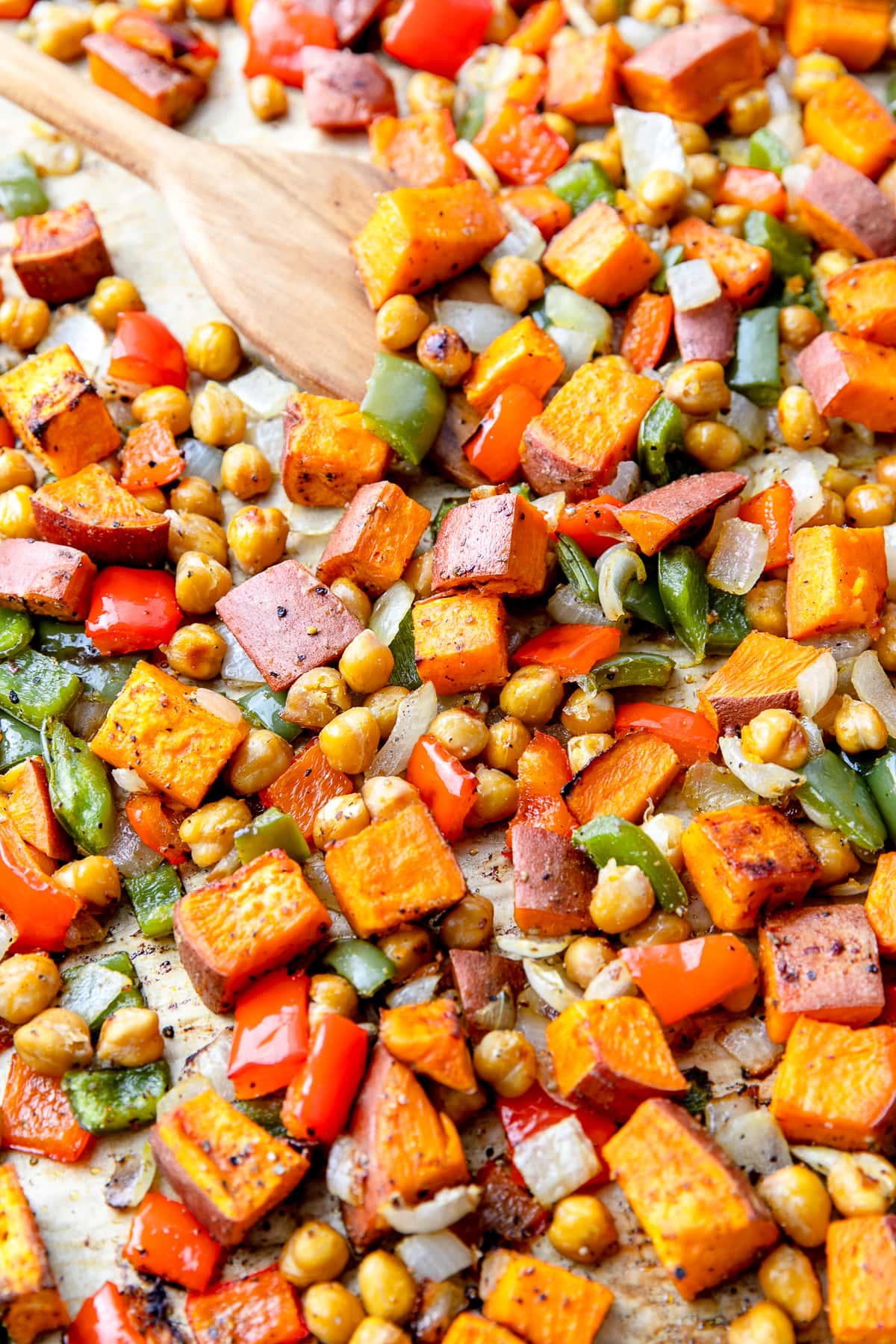 side angle view of baking sheet with fresh from the oven sweet potato breakfast hash.