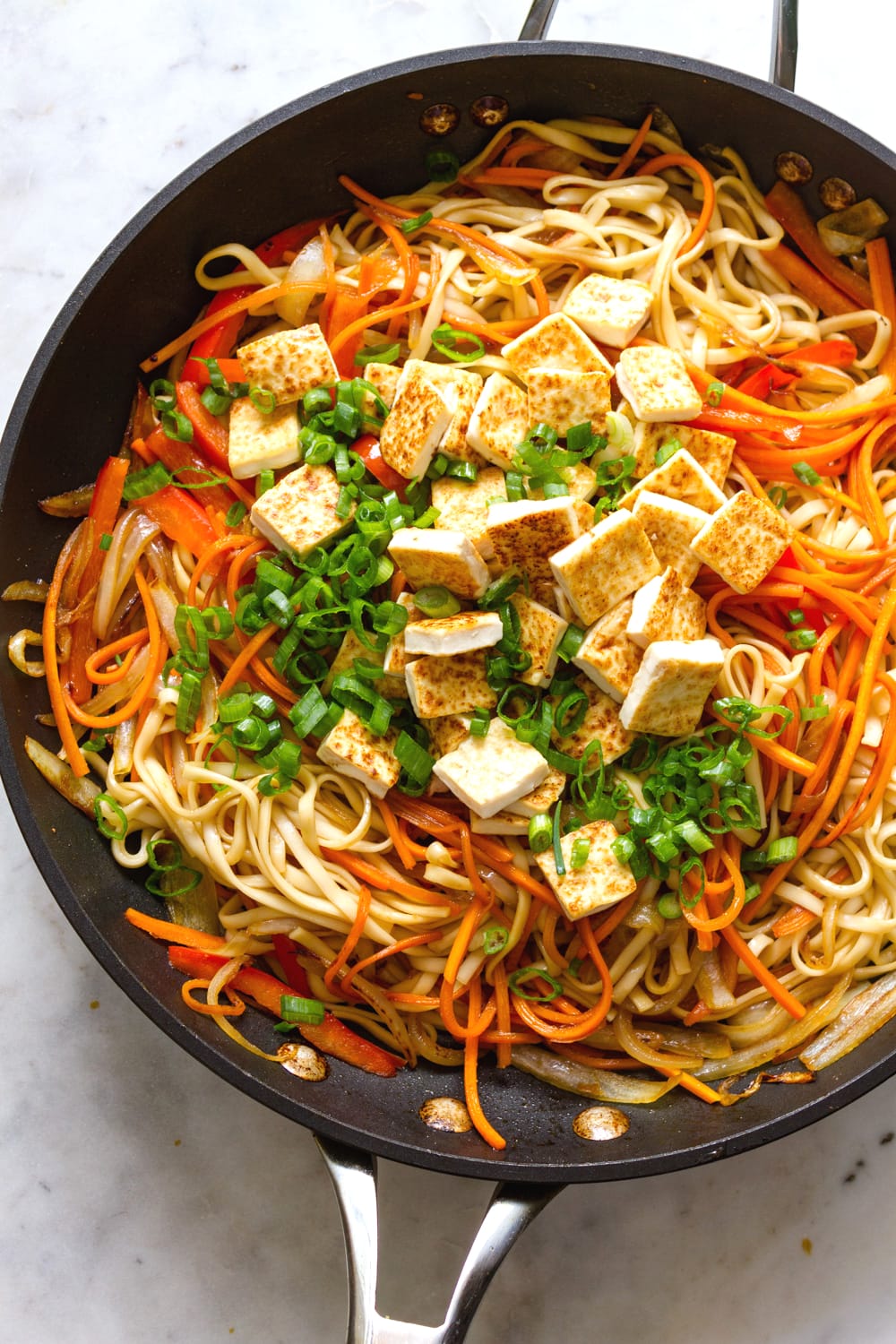 top down view of fresh cooked vegetable lo mein in a pan.