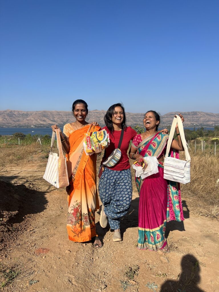 women holding plastic recycled materials